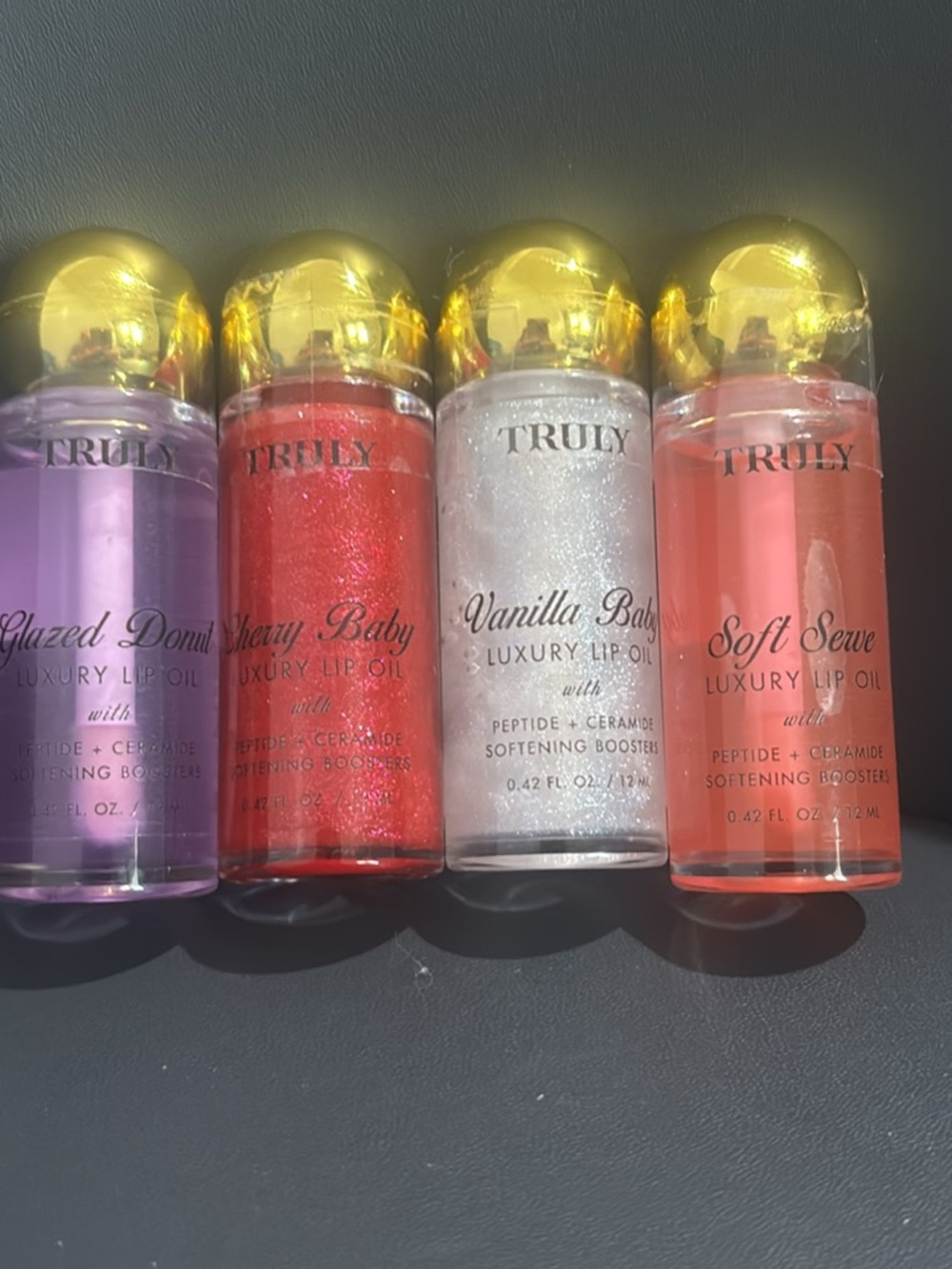 TRULY Luxury Lip Oil Quartet — Lavender, Red, Pearl, Coral